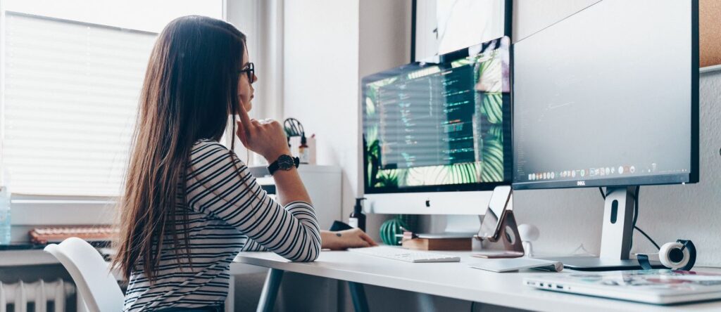 Picture of a programmer studying her code