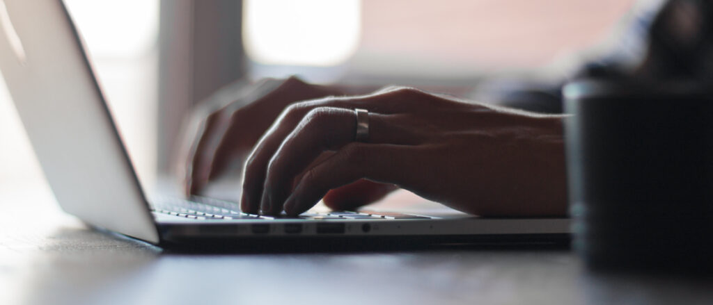 Picture of a person working on a laptop