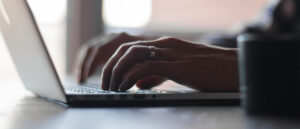 Picture of a person working on a laptop